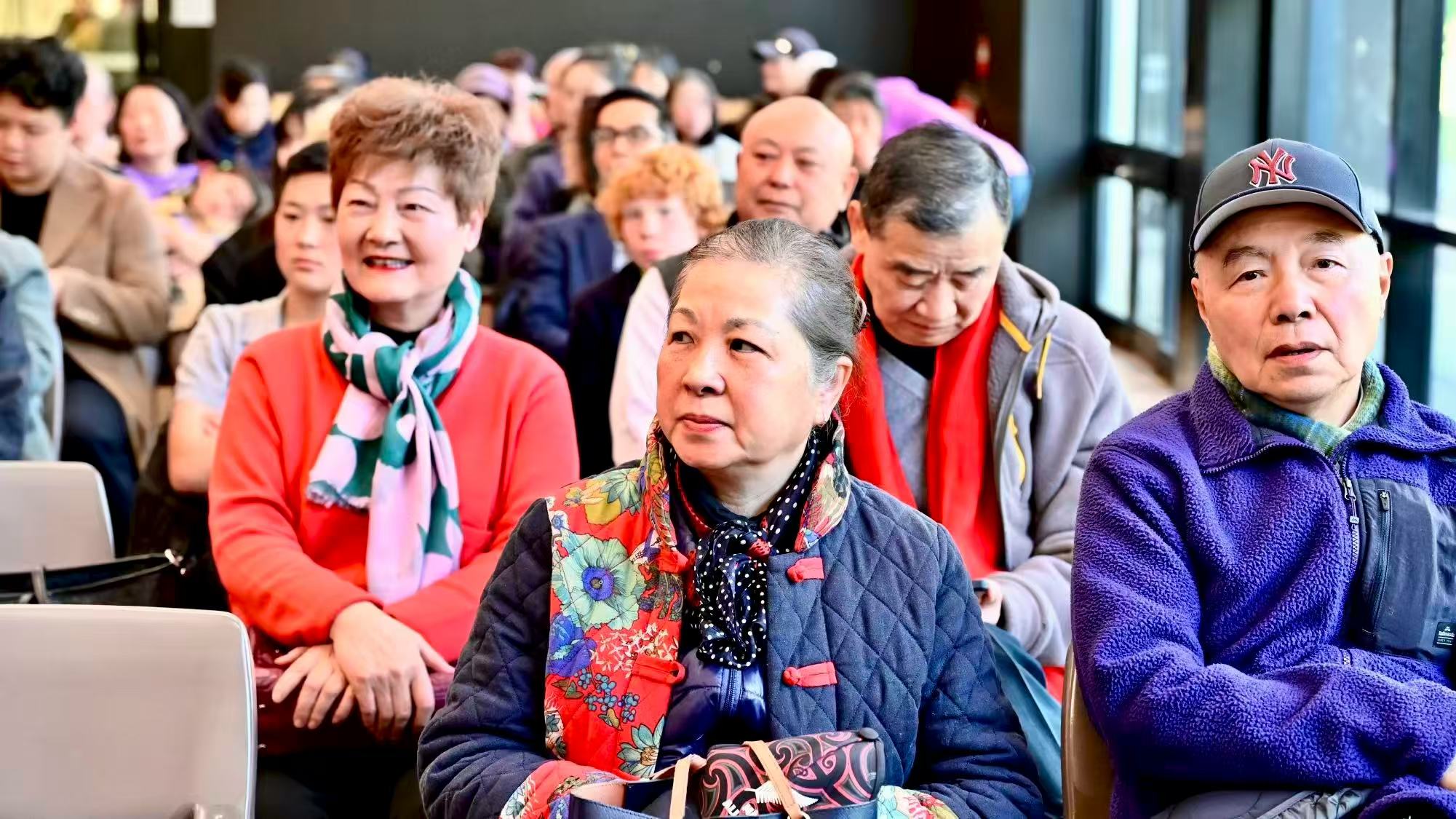 Guests taking part in the event from seats beside the windows