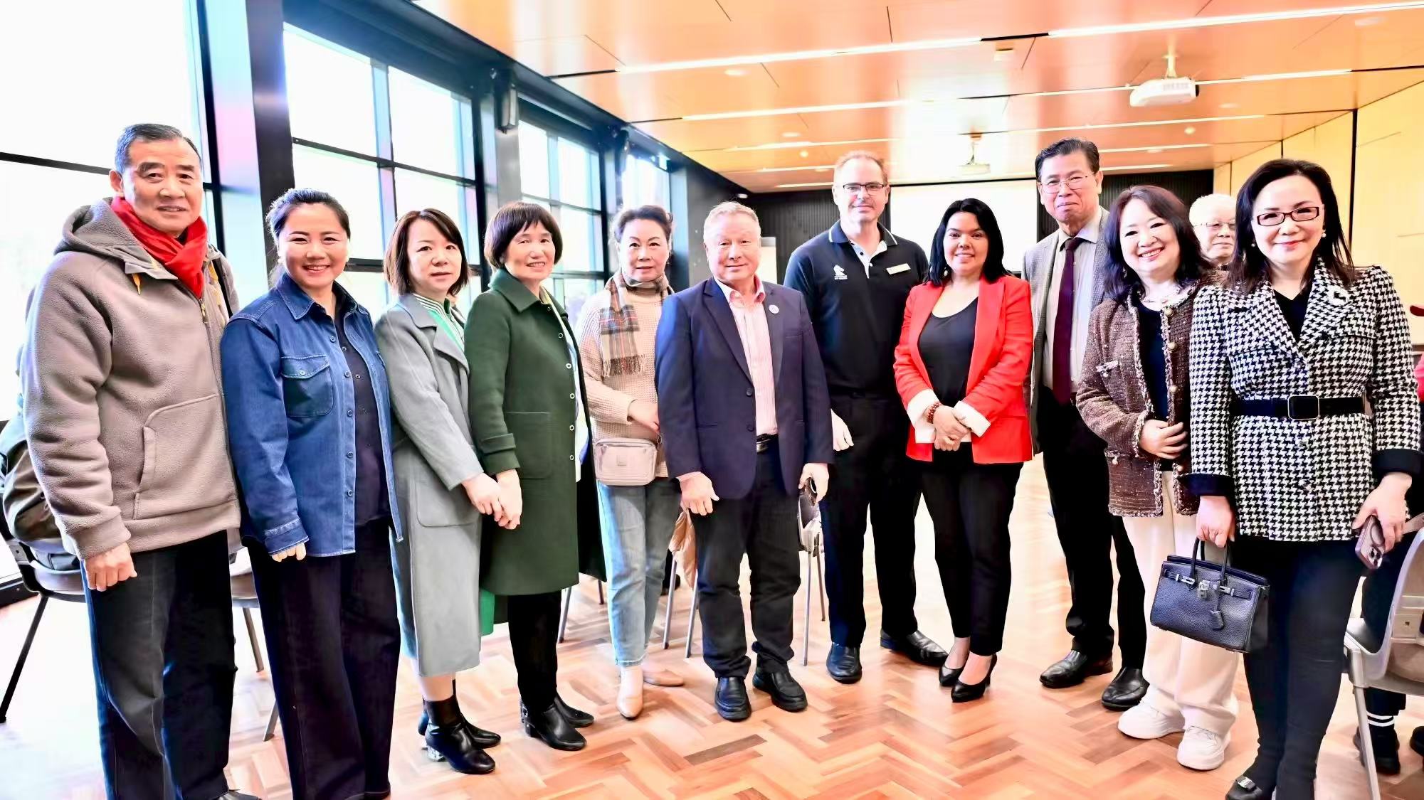 A group of guests posing for a photograph at the event venue